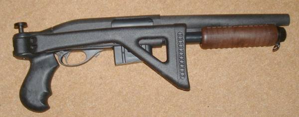 Compact gun still, with stock folded, although difficult to use left handed.
