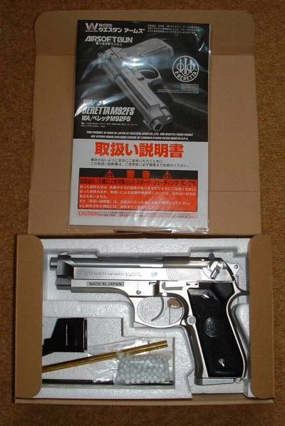 Loading tool, a few BBs, two allen keys and the gun in the box, as with the Silver model shown here.