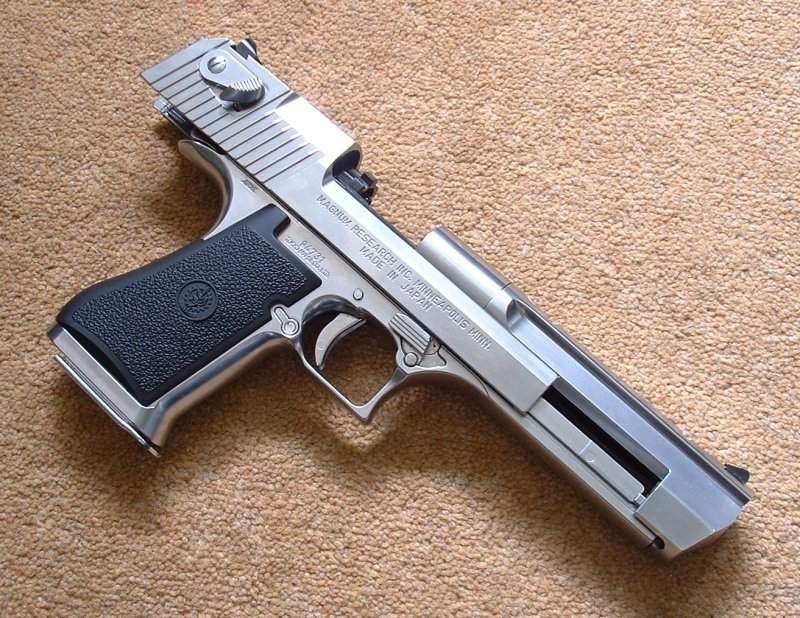 Not the most 'tactical' pistol, but the silver DE looks great. Note distinctive 'bolt' design in open chamber.