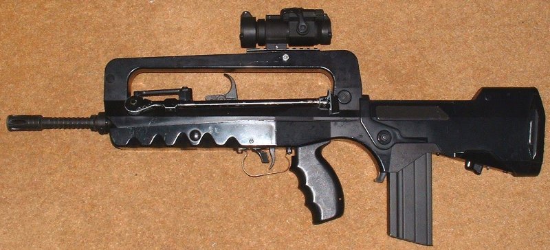 FAMAS equipped with replica of Aimpoint sight shown on real steel, above.
