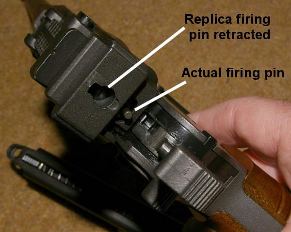 Firing pin retracts and...