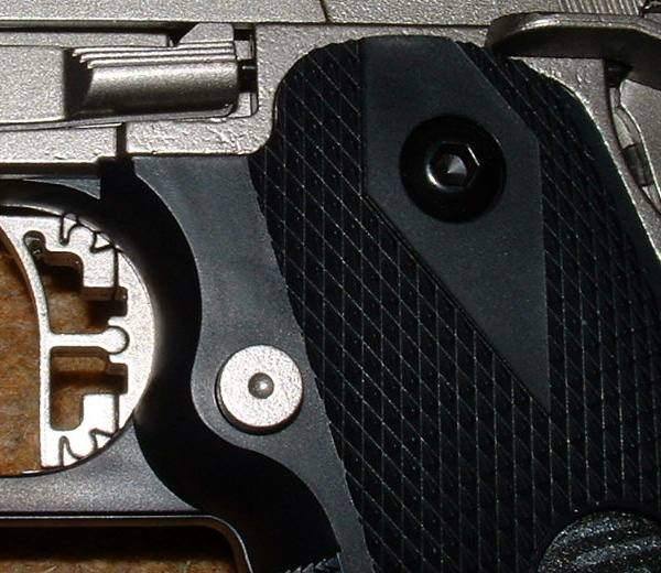 Interchangeable triggers a feature of Infinities. Note pitting on metal frame above grip.
