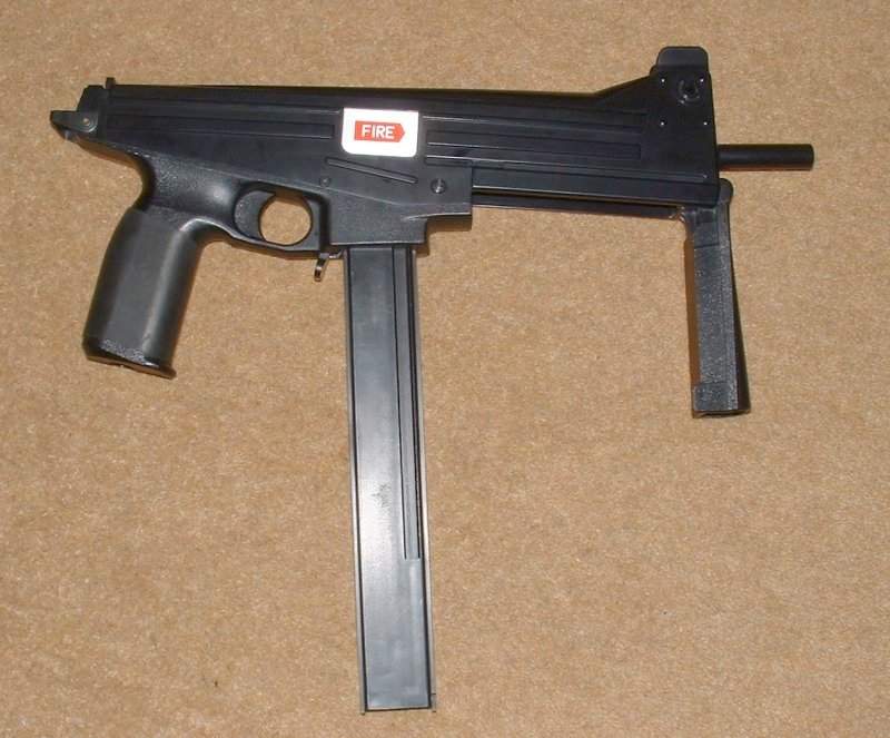 With front grip folded down, gun is purposeful - Odd styling due to angled bolt to reduce recoil.