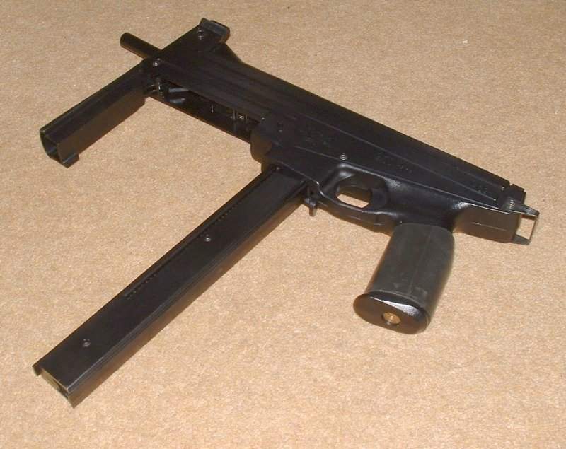 Compact SMG design. Magazines are typical of era and a bit flimsy.