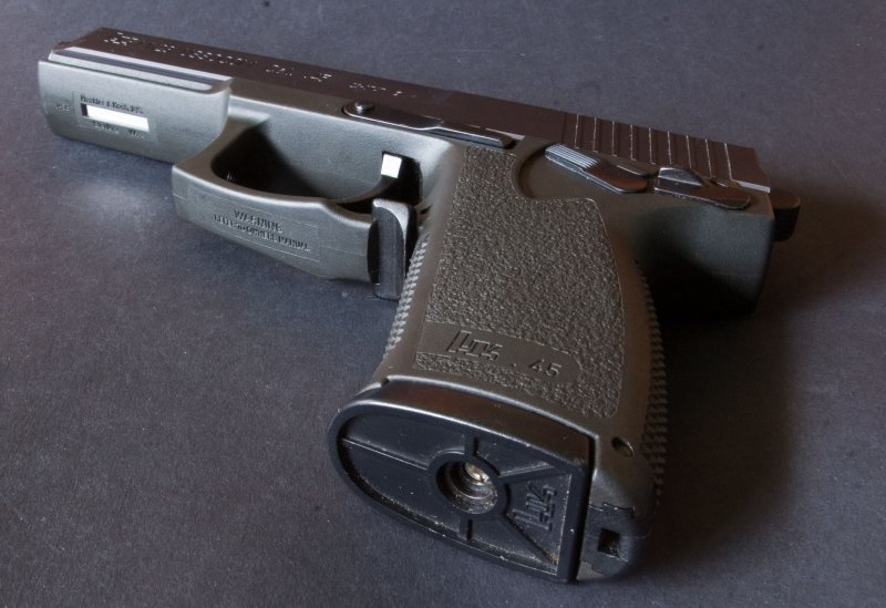 seam is faint and acceptable on replica of polymer frame. Note markings on mag base and under trigger guard.