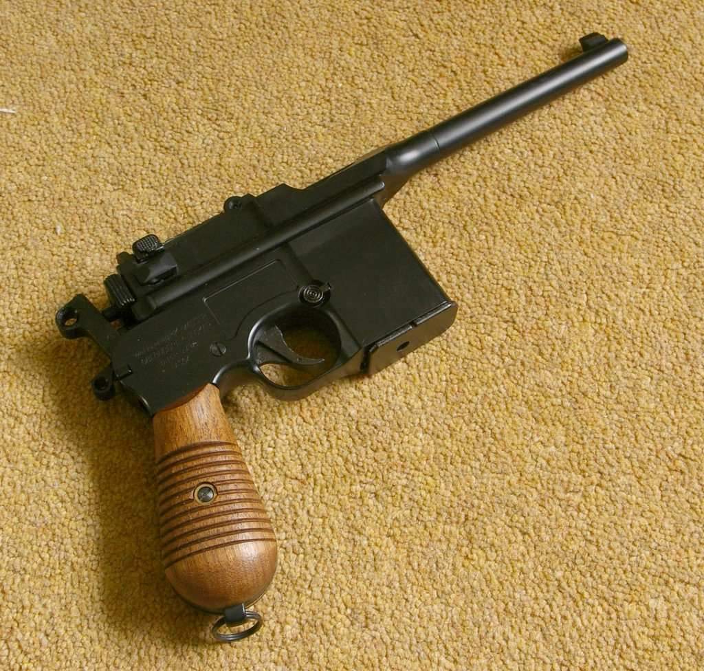 Unusual airsoft pistol, but nicely made and well replicated. Shown here with after market real wood grips.