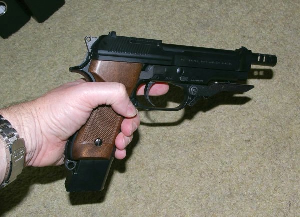 Basically 92FS sized, but with the longer barrel, heavier slide and bigger trigger guard.