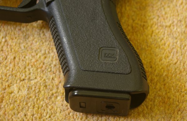 Good Glock logo on grip and mag baseplate - Note soft panels.