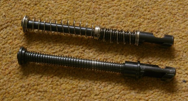 Revised 2005 style recoil rod shown lower.
