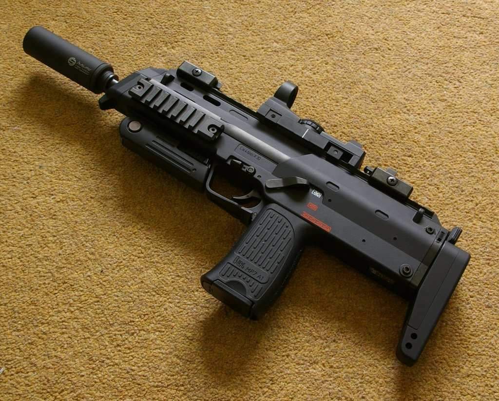 Accessorized with silencer and red dot scope, MP7 makes a great CQB primary