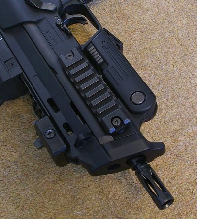 Flash-hider unscrews to reveal silencer thread - Rails and flip-up iron sights are standard.