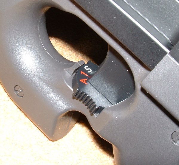 Safety/Selector on trigger. On A trigger will fire semi on short pull, full auto on longer.