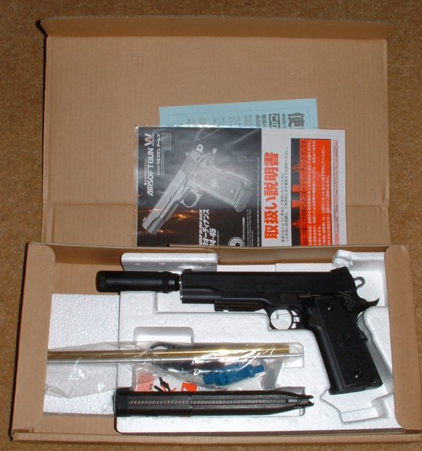 Silencer is fitted in box and 52 round magazine included, along with long loading tool.