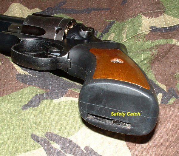 Unusual safety mechanism built into base of grip.