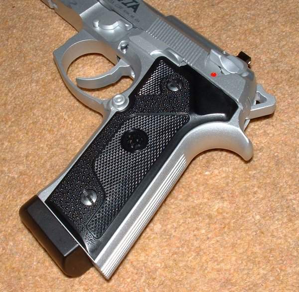 Original Beretta grip design featured.