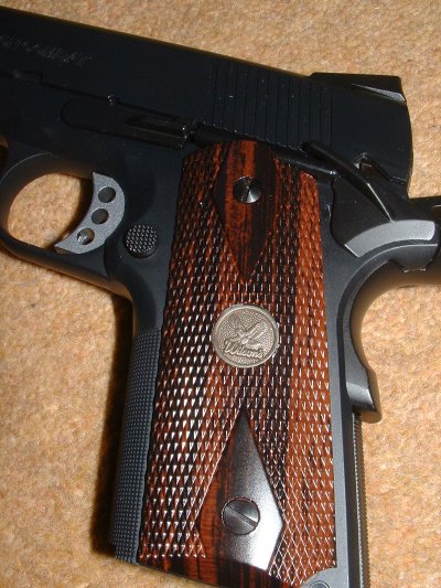 Grips almost look like real wood - Note licensed medallions.
