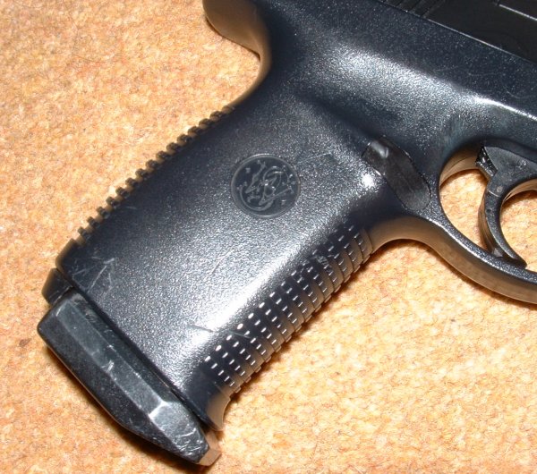 S&W logo prominent on grip. Note chequering front and rear.