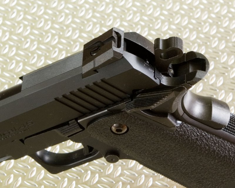 Novak style rear sight offers no adjustment or markings, but works well with dotted foresight