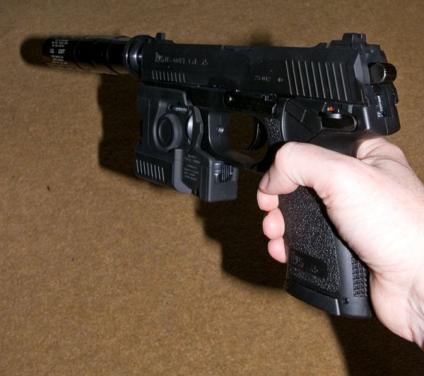 The Mk23 is a big gun, around 20 inches with silencer!