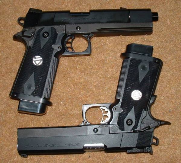 Side by  Side - Note selector, rail, lightened, shortened slide, lack of grip safety, one-piece trigger and simpler sights on Prokiller (Above). 