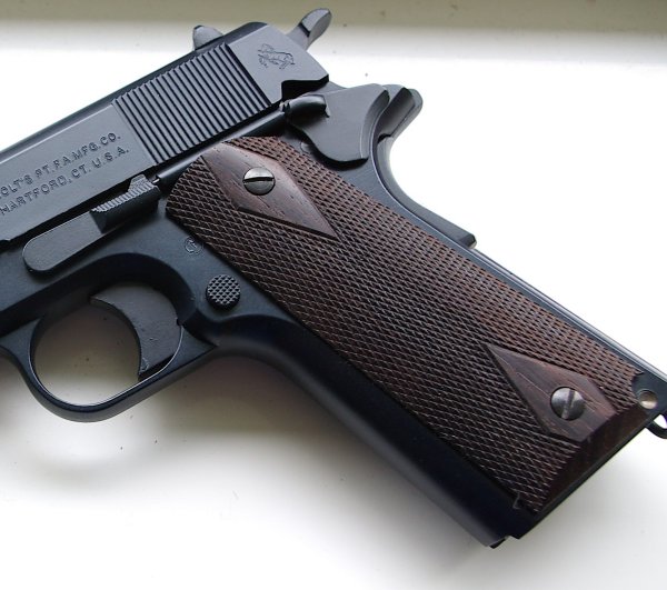 Wood grips add realism, but reduce weight.