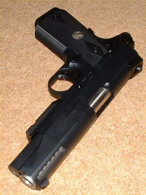 A modern 1911 (actually a 1996) for those looking for something a little more tactical in look.