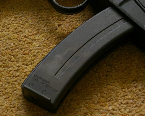Solid, curved magazine holds 30 rounds.
