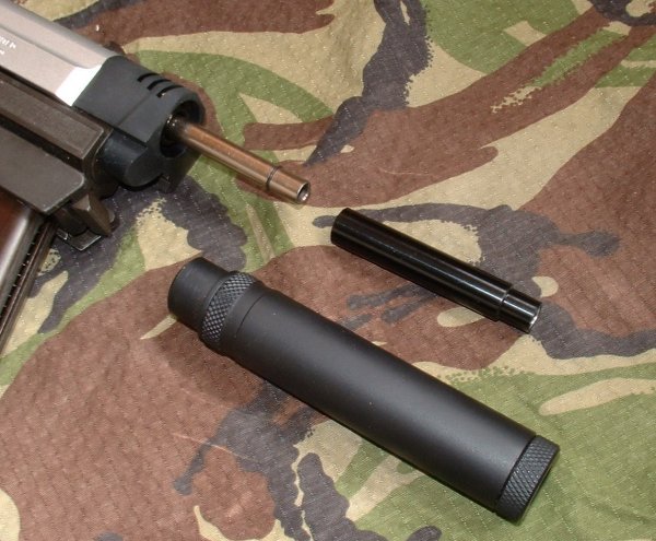 Silencer conceals extended tightbore barrel.