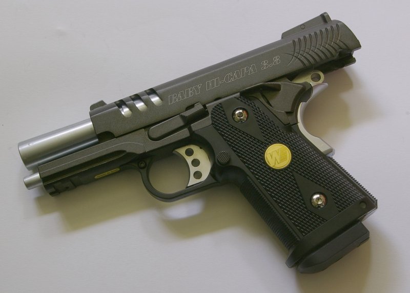 The Baby Hi-Capa features a number of custom style parts.