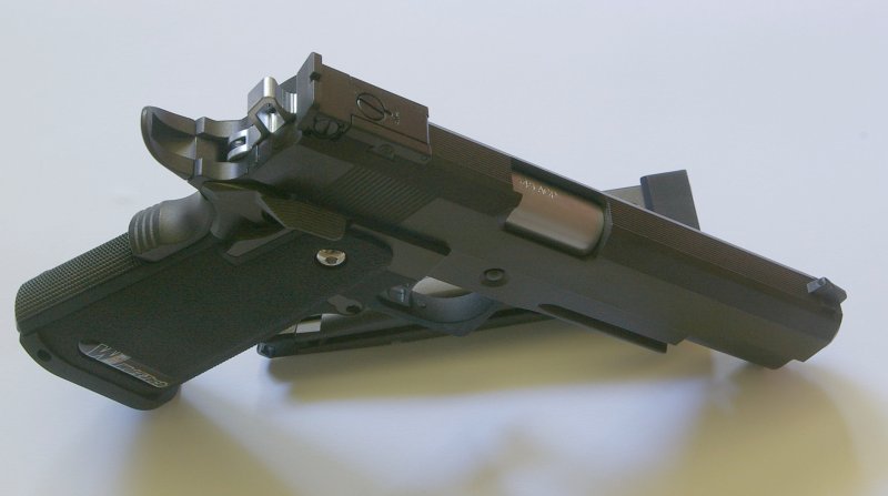 Adjustable sights, ambi safeties and silver chamber/barrel to contrast with slide/frame.